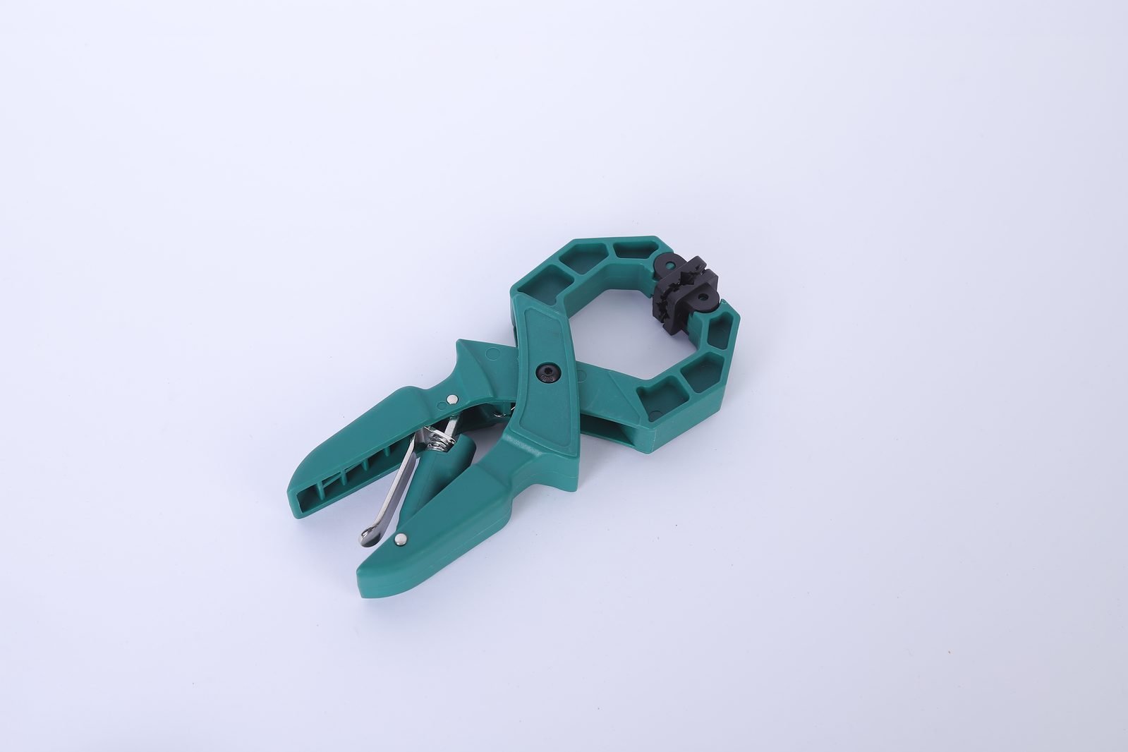 A single green Wildleg ratchet A-clamp on a white background, showing the ribbed nylon body, jaw pads and steel spring.
