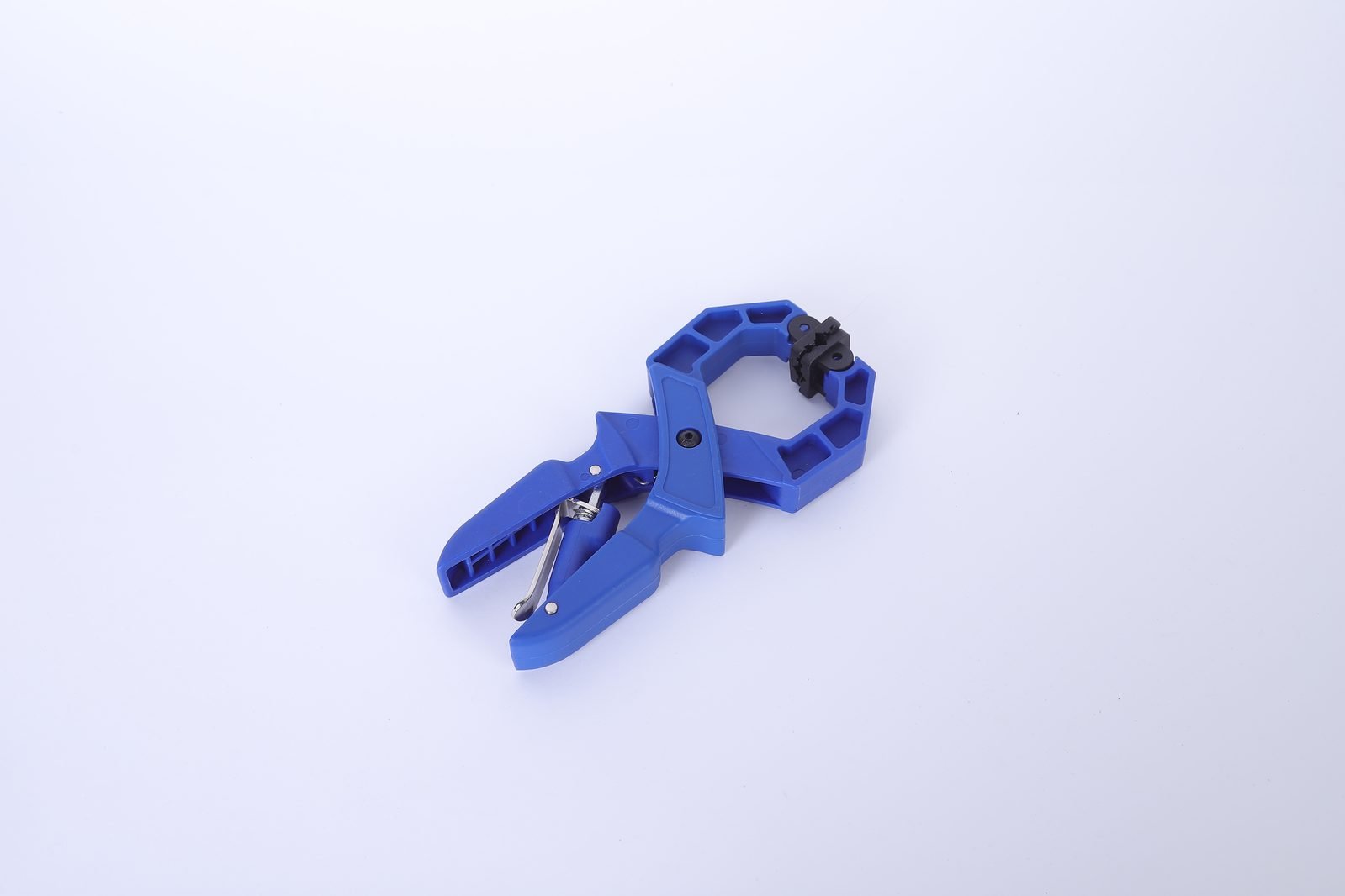 A single blue Wildleg ratchet A-clamp on a white background, showing the ribbed nylon body, jaw pads and steel spring.