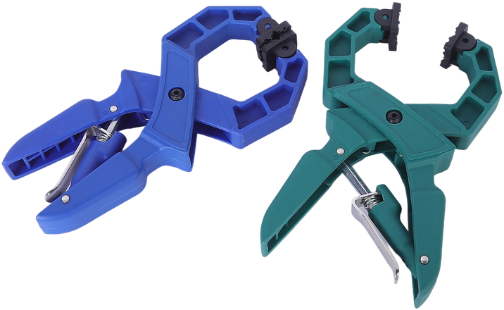 Two Wildleg ratchet A-clamps, one blue and one green, showing the ribbed nylon body, swivel jaw pads and steel spring.