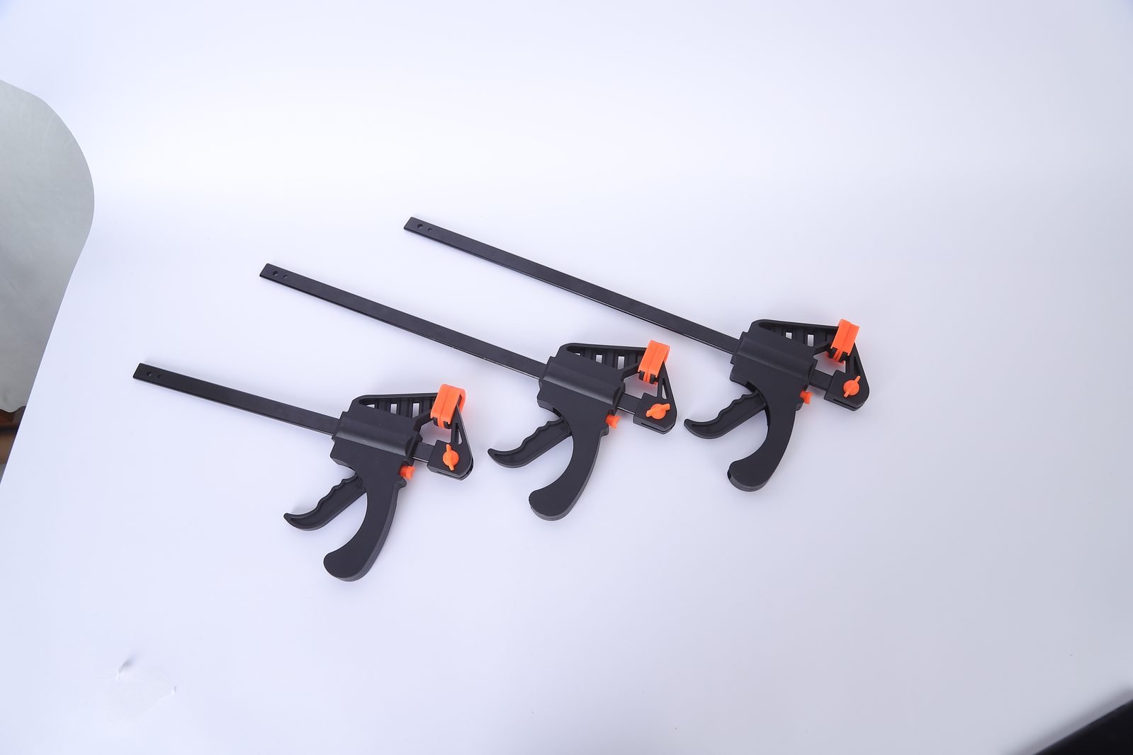 Three Wildleg trigger bar clamps of different lengths arranged side by side to show the size range.